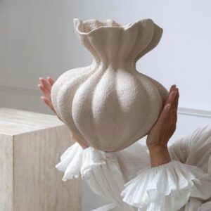 Knitted throw blanket folded on a bed