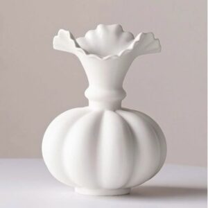 Knitted throw blanket folded on a bed