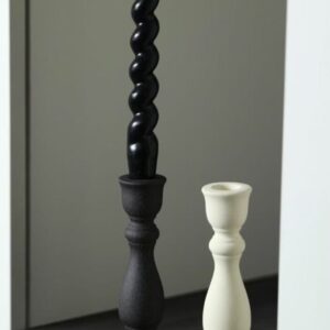 Sculpted candle holder placed on a coffee table