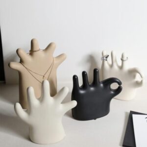 Sculpted candle holder placed on a coffee table