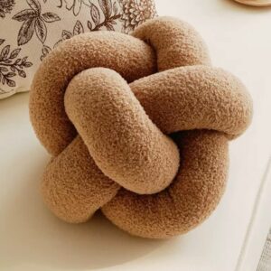 Sculpted candle holder placed on a coffee table