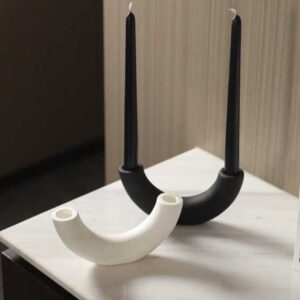 Sculpted candle holder placed on a coffee table