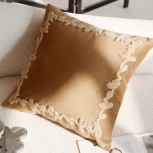 Neutral-toned decorative pillows on a sofa