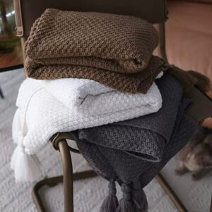 Neutral-toned decorative pillows on a sofa